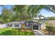 Charming single-story home featuring a bright yellow front door and an attached one-car garage at 3703 Pembrook Dr, Orlando, FL 32810