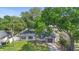 Charming one-story house boasting a well-kept lawn and a striking yellow entrance door at 3703 Pembrook Dr, Orlando, FL 32810