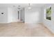 Bright living room featuring tile flooring, and natural light from the window at 3703 Pembrook Dr, Orlando, FL 32810