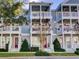 Two-story building with multiple units, balconies, and white columns at 535 Crimson Ln, Winter Springs, FL 32708