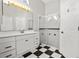 Bathroom featuring vanity, glass shower, and checkered tile floors at 5418 S Bracken Ct, Winter Park, FL 32792