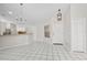 Bright living room with tile flooring open to the kitchen area at 5418 S Bracken Ct, Winter Park, FL 32792