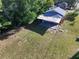 Aerial view of backyard with covered patio at 620 Oak St, Auburndale, FL 33823