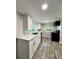 Modern kitchen featuring white cabinets and quartz countertops at 620 Oak St, Auburndale, FL 33823