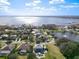 Stunning aerial view of a lakeside community with beautiful homes and lush greenery at 10542 Wittenberg Way, Orlando, FL 32832