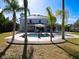 Backyard with a pool, outdoor furniture, and landscaping at 10542 Wittenberg Way, Orlando, FL 32832