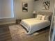 Serene bedroom featuring a comfortable bed, soft lighting, and modern decor at 10542 Wittenberg Way, Orlando, FL 32832