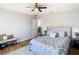 Bedroom with ceiling fan, neutral color scheme and accent pillows at 10542 Wittenberg Way, Orlando, FL 32832