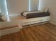 Bedroom with built-in bed and storage, wood look flooring, and neutral tones at 10542 Wittenberg Way, Orlando, FL 32832