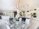 This gourmet kitchen features a large island, modern appliances, and is part of a sunny open floor plan at 10542 Wittenberg Way, Orlando, FL 32832