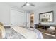 Bedroom featuring a mirrored dresser, closet, and serene decor with plush bed at 14132 Murcott Blossom Blvd, Winter Garden, FL 34787
