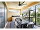 Enjoy the outdoor kitchen, grill, dining table, and screened windows on this large lanai at 14132 Murcott Blossom Blvd, Winter Garden, FL 34787
