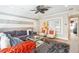 Comfortable living room with striped walls, plush seating, shag rug, and modern decor at 14132 Murcott Blossom Blvd, Winter Garden, FL 34787
