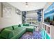Comfortable seating area with a bright, colorful decor, television, and ceiling fan at 14132 Murcott Blossom Blvd, Winter Garden, FL 34787