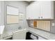 Efficient home office space with ample cabinet storage and well-organized display boards at 14132 Murcott Blossom Blvd, Winter Garden, FL 34787
