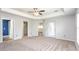 Primary bedroom with en-suite bath and ample closet space features new paint and carpet at 4245 Arlington Ridge Blvd, Leesburg, FL 34748