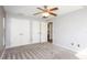 Bedroom with carpet and ceiling fan and double door closet at 4245 Arlington Ridge Blvd, Leesburg, FL 34748