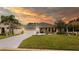 Charming single-story home with a well-manicured lawn, gray roof, and a two-car garage at 4245 Arlington Ridge Blvd, Leesburg, FL 34748