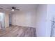 Bedroom with grey wood floors and view of closet and bathroom at 261 Dublin Dr, Lake Mary, FL 32746