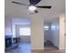 Bright living room with ceiling fan, fireplace, and open access to dining and front entry at 261 Dublin Dr, Lake Mary, FL 32746