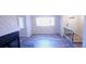 Bright living room featuring a fireplace, large window, and modern wood-look floors at 261 Dublin Dr, Lake Mary, FL 32746