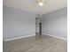 Neutral colored bedroom with wood flooring, closet, and ceiling fan at 5783 Peregrine Ave # C07, Orlando, FL 32819
