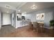 Dining room area, kitchen with stainless steel appliances and eat-in bar at 5783 Peregrine Ave # C07, Orlando, FL 32819