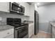 Well-equipped kitchen features modern appliances, granite countertops, and ample cabinet space at 5783 Peregrine Ave # C07, Orlando, FL 32819