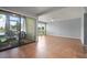 Bright living room leads to a screened patio overlooking the water at 5783 Peregrine Ave # C07, Orlando, FL 32819
