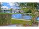 Charming pond view with swans swimming, enhancing the community's natural beauty at 5783 Peregrine Ave # C07, Orlando, FL 32819