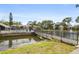 The complex features a peaceful pond connected by a walking bridge at 5783 Peregrine Ave # C07, Orlando, FL 32819
