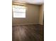 Bedroom with modern flooring, a window, and a neutral color scheme at 120 Hibiscus Woods Ct # 8D, Deltona, FL 32725