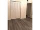 Bedroom showing closet space and wood-style flooring at 120 Hibiscus Woods Ct # 8D, Deltona, FL 32725
