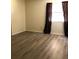 Cozy bedroom with modern flooring, natural light, and neutral paint at 120 Hibiscus Woods Ct # 8D, Deltona, FL 32725