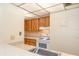 Functional kitchen featuring wood cabinets, a white stove, and ample counter space at 120 Hibiscus Woods Ct # 8D, Deltona, FL 32725