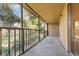 Relaxing screened patio with a peaceful view of trees and lawn at 120 Hibiscus Woods Ct # 8D, Deltona, FL 32725