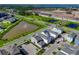 Aerial view of community, showing homes and a pond at 344 Belmond Dr, Debary, FL 32713