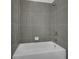 Shower/tub combo with grey tile in a small bathroom at 344 Belmond Dr, Debary, FL 32713