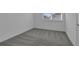 Simple bedroom with grey carpet and neutral walls at 344 Belmond Dr, Debary, FL 32713