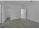 Spacious bedroom with grey carpet, neutral walls, and access to closet at 344 Belmond Dr, Debary, FL 32713