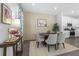 Bright dining area with a round table and gray chairs near kitchen at 344 Belmond Dr, Debary, FL 32713