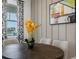 Bright dining room with a round table and yellow orchid centerpiece at 344 Belmond Dr, Debary, FL 32713