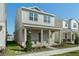 Two-story house with light beige siding, stone accents, and a covered porch at 344 Belmond Dr, Debary, FL 32713