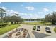 Scenic golf course view with fire pit and golf carts at 344 Belmond Dr, Debary, FL 32713