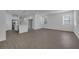 Open living room and kitchen with grey vinyl flooring at 344 Belmond Dr, Debary, FL 32713