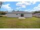 Expansive backyard featuring lush lawn and a patio area perfect for outdoor entertaining and relaxation at 3590 Sw 150Th Ct, Ocala, FL 34481