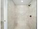 Modern walk-in shower features updated tile, modern showerhead, and sleek fixtures at 3590 Sw 150Th Ct, Ocala, FL 34481