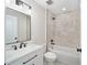 Bathroom featuring tub, tile surround, modern vanity with black fixtures, and neutral finishes at 3590 Sw 150Th Ct, Ocala, FL 34481