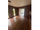 Cozy living room features natural lighting with wood flooring, and backyard access at 4663 Montauk St, Orlando, FL 32808