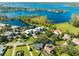 Overhead view of waterfront homes surrounded by mature trees and lush green lawns at 8984 Houston Pl # 103, Orlando, FL 32819